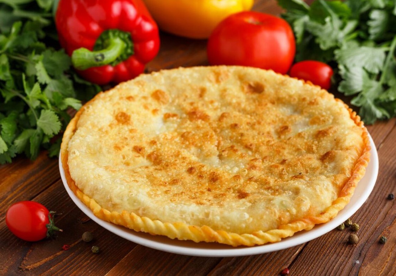 Crocante por fora, suculento por dentro: Gosh Naan – tarte de carne frita uigur